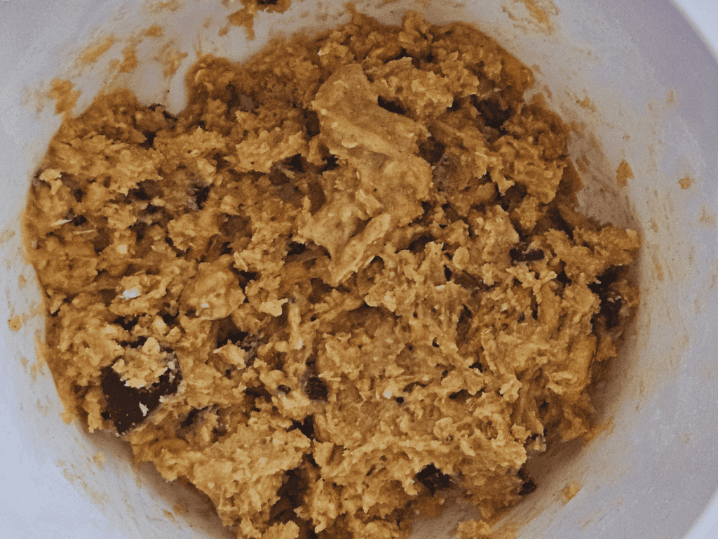 Add butter, the egg, and the mix in a bowl and combine using hands